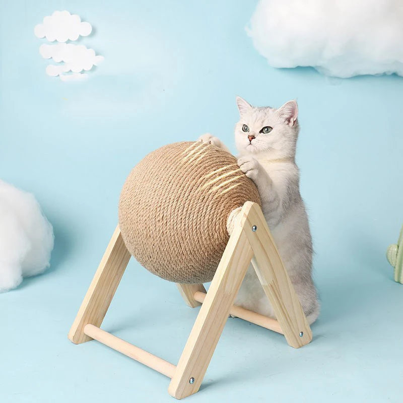 Cat scratching the sisal ball on its wooden base