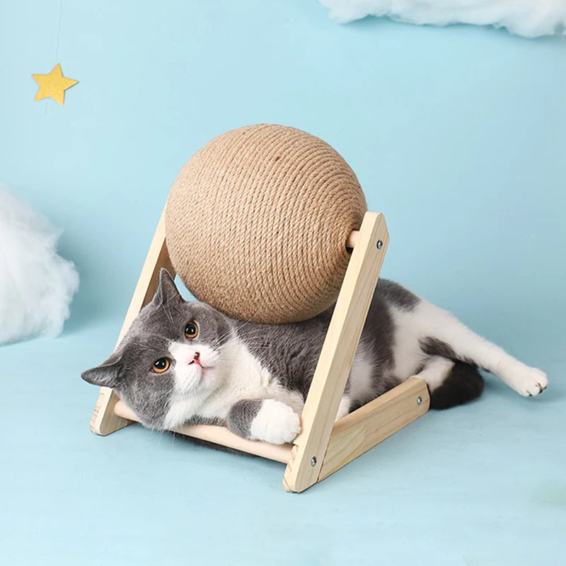 Cat leaning against the sisal scratching ball