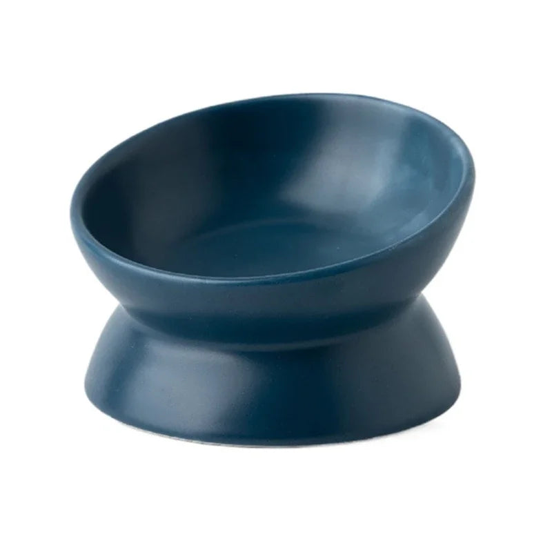 Top-down view of the empty petrol blue cat bowl, showing its 15° tilted opening