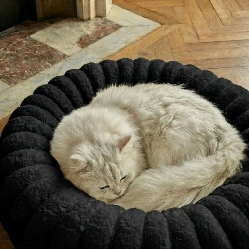 Black round cat bed, back view