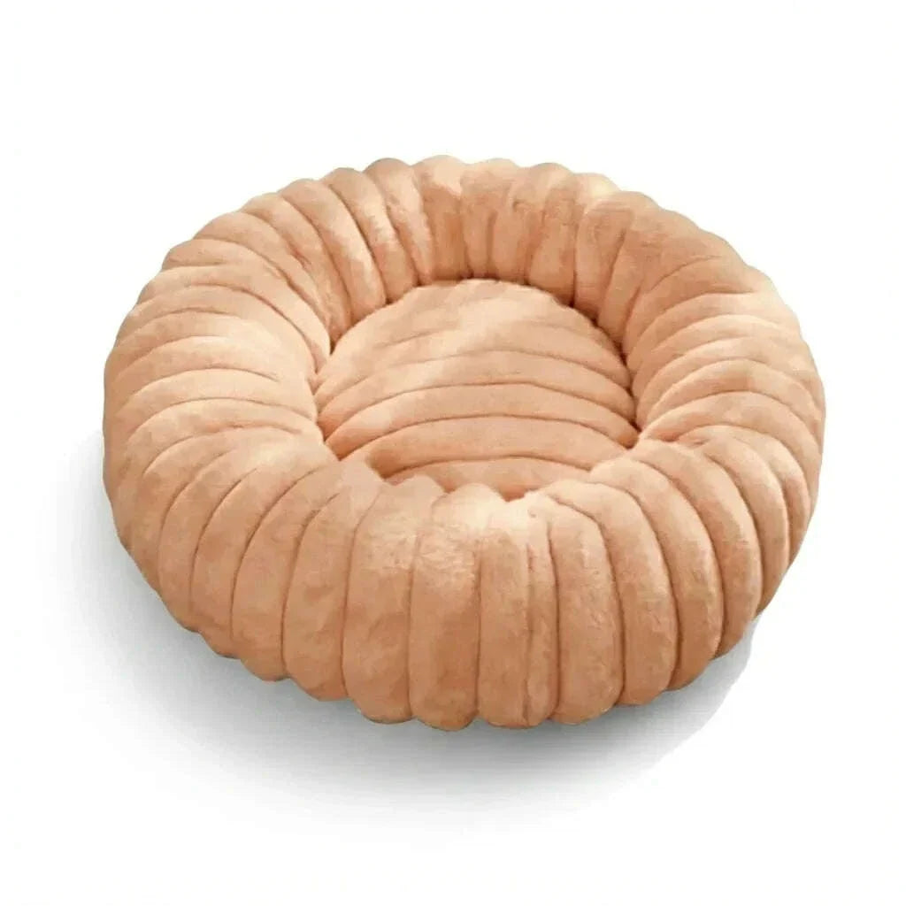 Panier donut pour chat couleur abricot, peluche épaisse à côtes marquées, présenté sur fond blanc uni