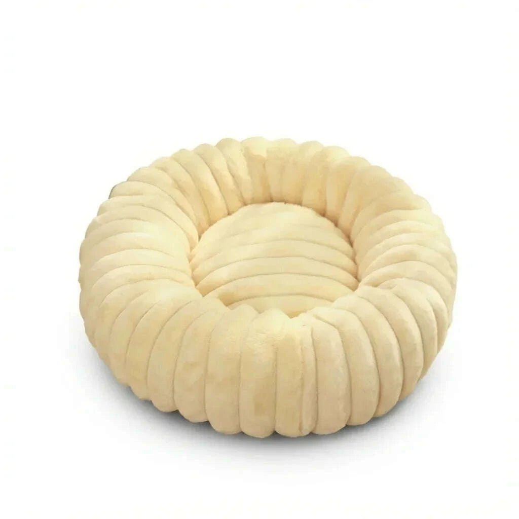 Beige round plush cat bed