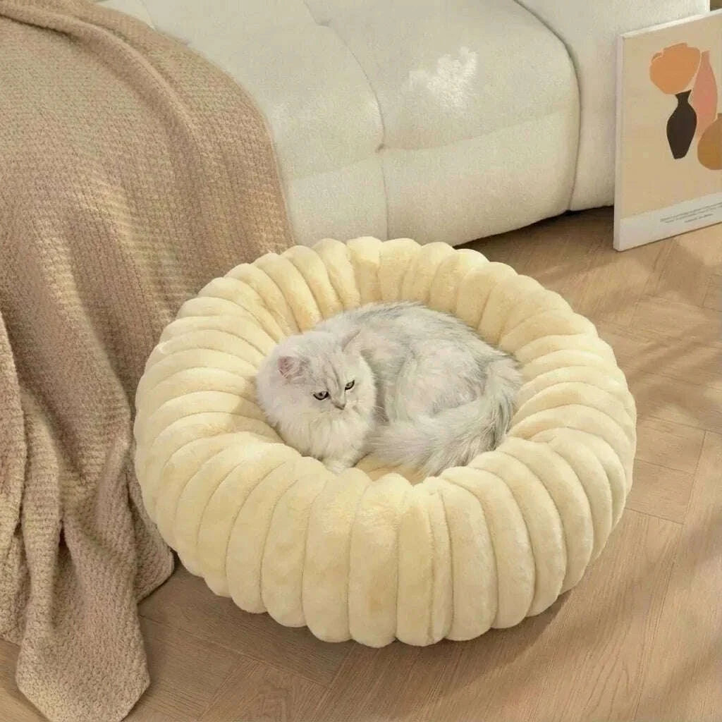Beige round plush cat bed