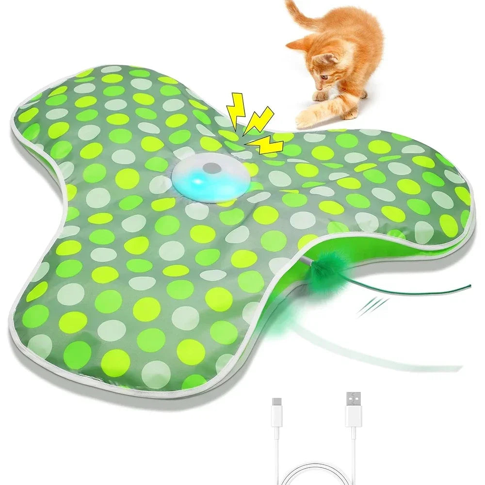 Tapis électrique vert à pois en forme de trèfle avec boîtier bleu lumineux, chaton roux et câble USB-C