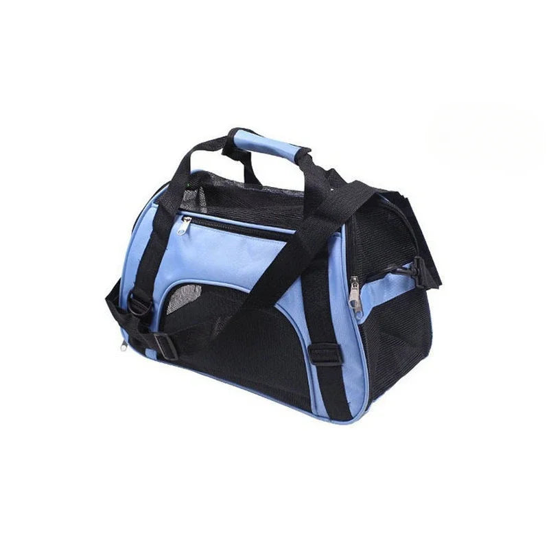 Cabas souple bleu clair et noir pour chat, sangle croisée, poignée rembourrée et poche zippée, sur fond blanc