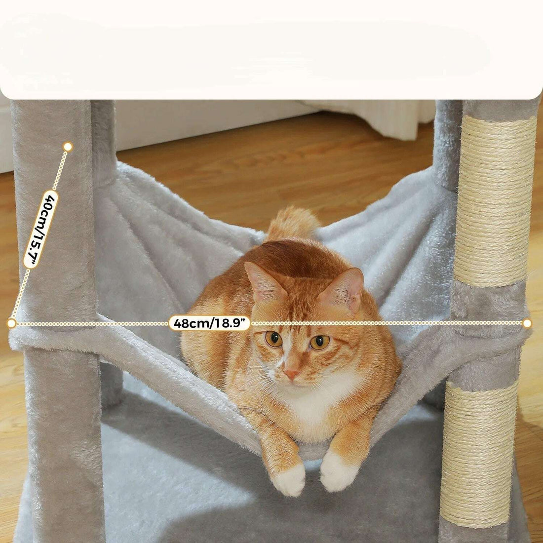 Orange cat lying in the light gray cat hammock, 48x40 cm dimensions shown in close-up