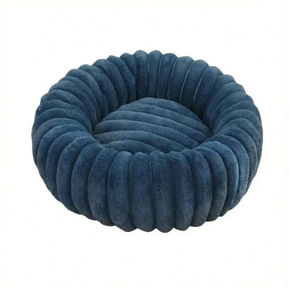 Panier rond pour chat en peluche bleu pétrole à bourrelet côtelé, vue de dessus sur fond blanc
