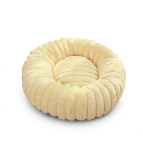 Beige round plush cat bed