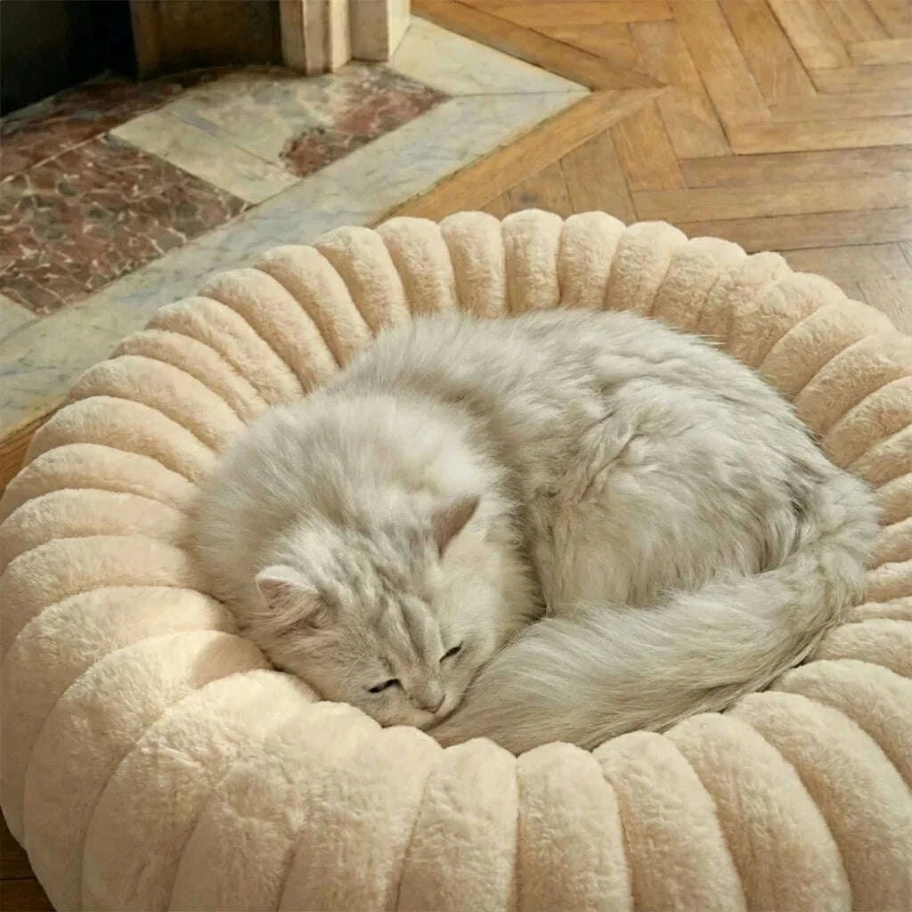 Beige round plush cat bed