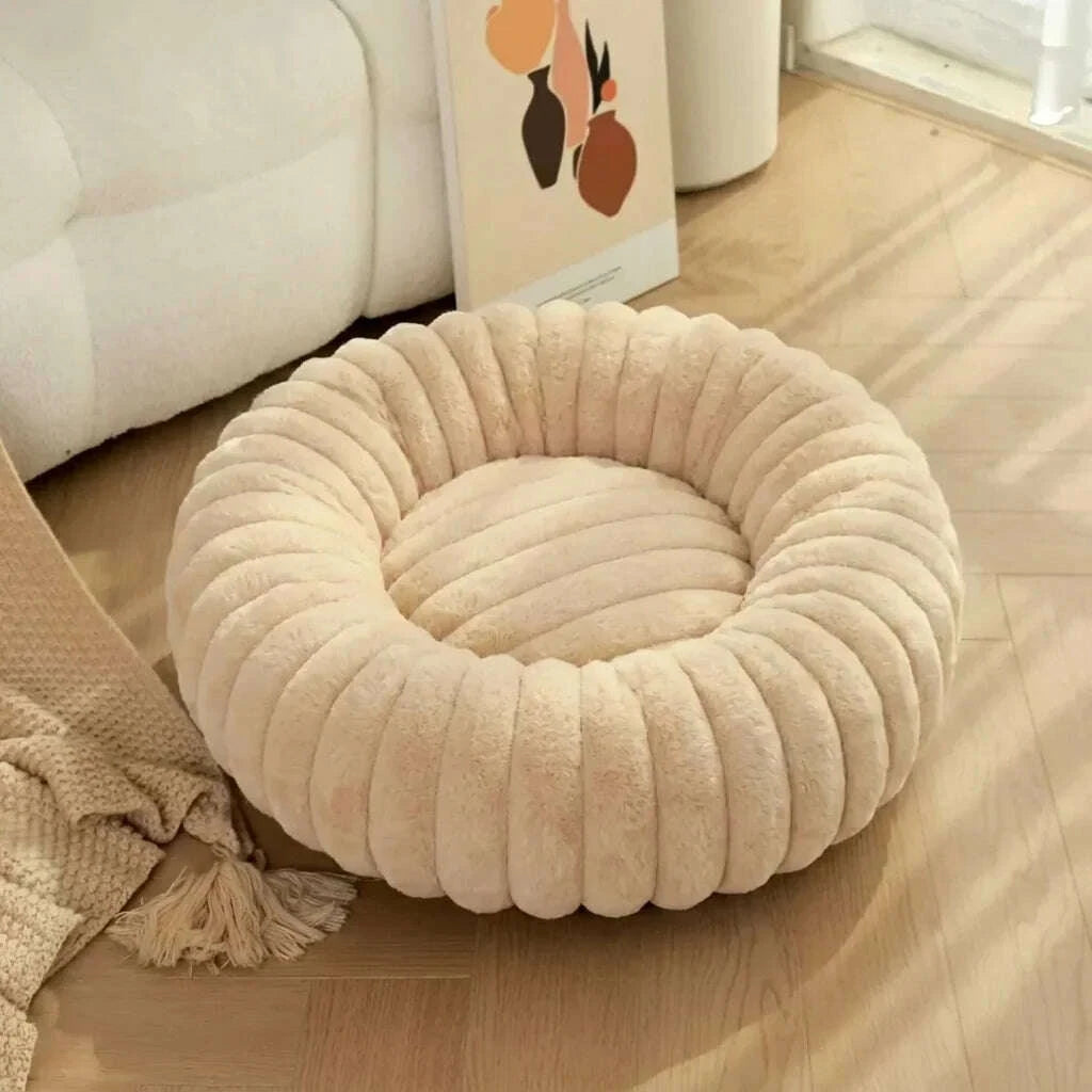 Beige round plush cat bed