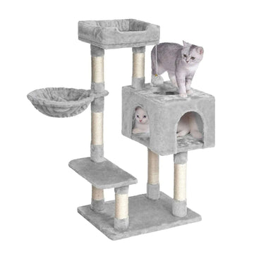 Light gray multi-level cat tree with two cats, one inside the cube-shaped cat house
