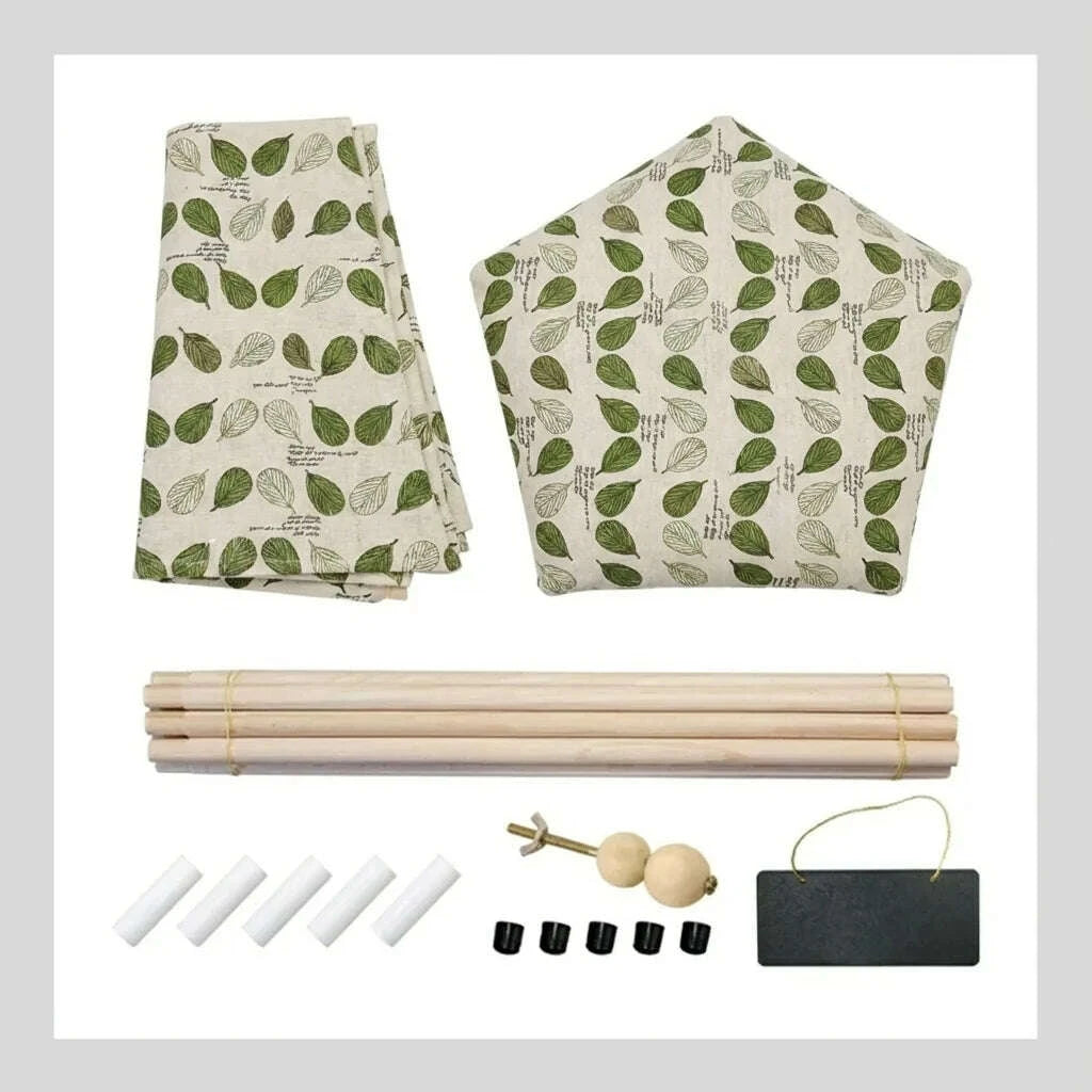 Contenu du kit à monter : toile et coussin pentagonal à feuilles, cinq mâts en bois, embouts